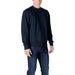 Man wearing Colmar Originals Men’s Blue Sweatshirt with navy sweatshirt and jeans