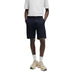 Man wearing white shirt and Boss Men black shorts from the Boss product line