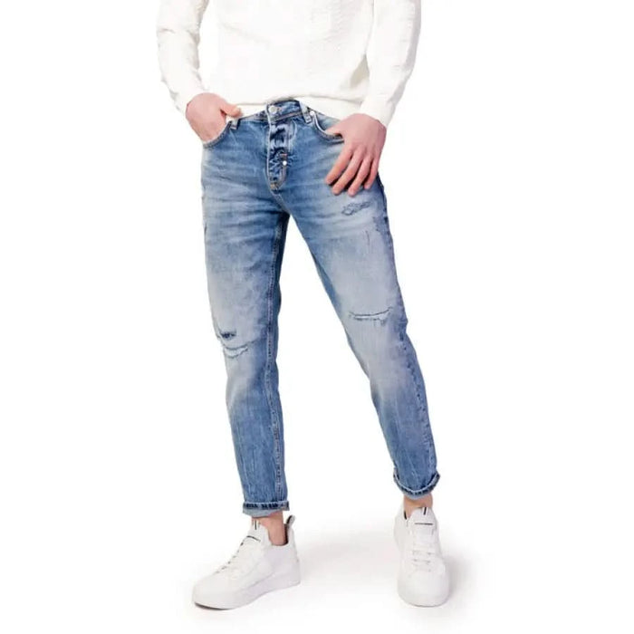 Antony Morato men jeans paired with white sweater for an urban city fashion look