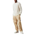 Man wearing white sweater and beige cargo pants with white sneakers Calvin Klein Men Trousers