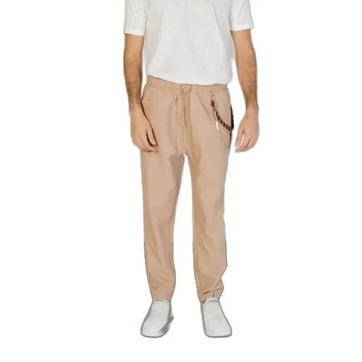 Man wearing Gianni Lupo Men Trousers in white shirt and khaki pants