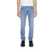 Man in urban style clothing: white T-shirt and Jeckerson Men Jeans