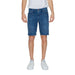 Man modeling Jeckerson Men Shorts in white t-shirt and blue shorts