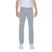 Man in white t-shirt and grey Jeckerson Men Trousers, urban style clothing