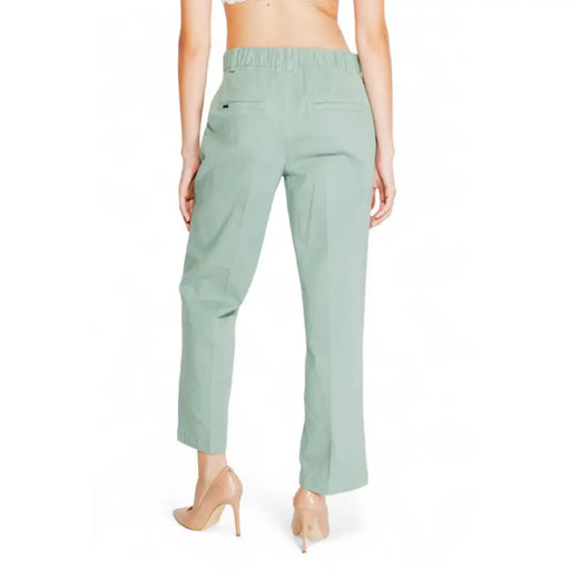 Mint green dress pants worn by a woman, showcased in Street One Women Trousers