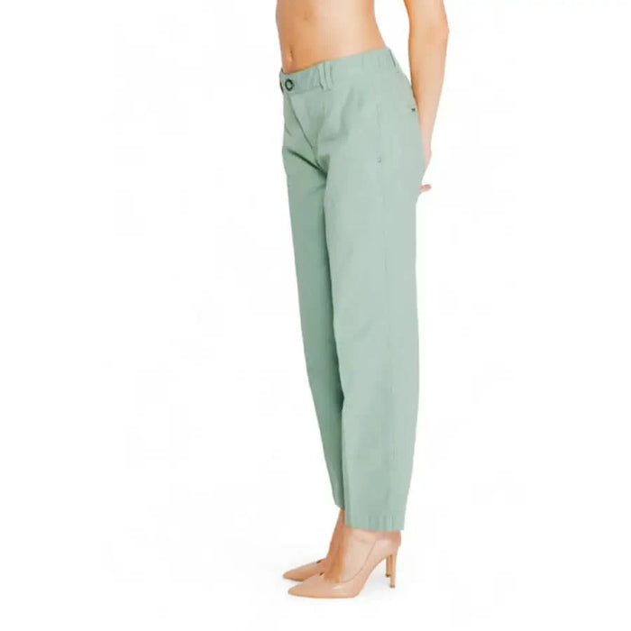 Mint green high-waisted trousers worn by a woman from Street One in a stylish setting