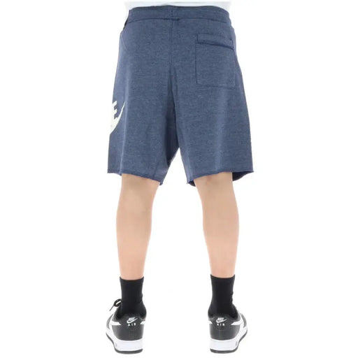 Navy blue Nike men’s athletic shorts with a light-colored logo on the side