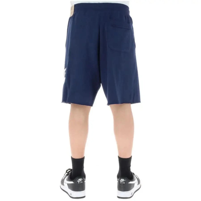 Navy blue Nike Men Shorts with a side pocket, ideal for athletic activities