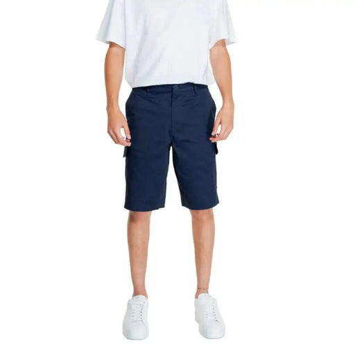 Navy blue cargo shorts paired with a white t-shirt and white sneakers by Armani Exchange Men Shorts