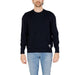 Navy blue crewneck sweater paired with light blue jeans from Armani Exchange Men Knitwear