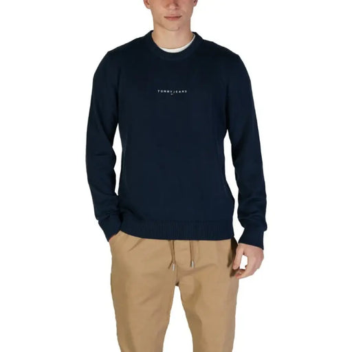 Navy blue crewneck sweatshirt featuring minimal text branding by Tommy Hilfiger