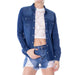 Navy blue denim button-up shirt over white lace crop top and distressed shorts