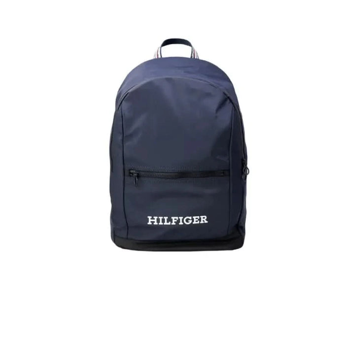 Navy blue Tommy Hilfiger backpack featuring a front zippered pocket for men’s fashion