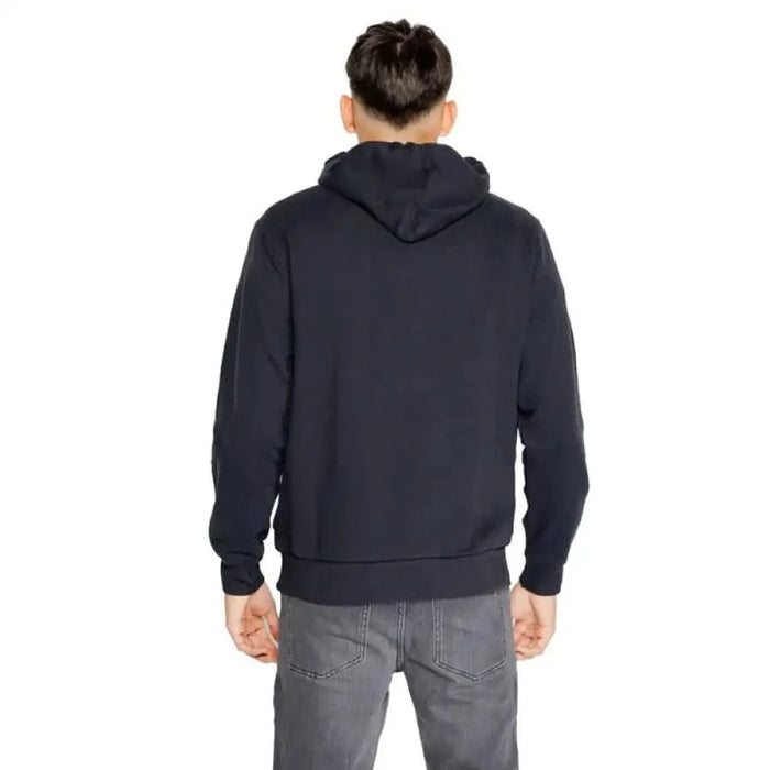 Navy blue hooded sweatshirt on individual viewed from behind by Napapijri