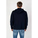 Navy blue hooded sweatshirt modeled, from Tommy Hilfiger Jeans Men Sweatshirts collection