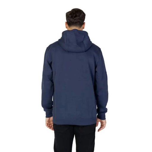 Navy blue hooded sweatshirt worn by a person viewed from behind Tommy Hilfiger Jeans Men Sweatshirts