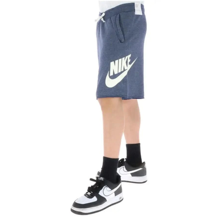 Navy blue Nike men’s shorts with white logo on the side