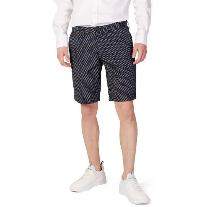 Armani Exchange Men Shorts Navy Blue Patterned with Small White Dots Worn by Person in White Shirt