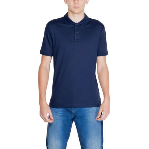 Navy blue Calvin Klein Men Polo shirt worn by an individual in casual setting