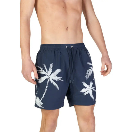 Navy blue swim shorts with white palm tree prints from Boss Men’s Blue Printed Swimwear