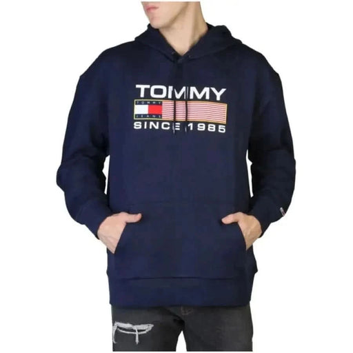 Navy blue Tommy Hilfiger hoodie with logo and SINCE 1985 text on the front