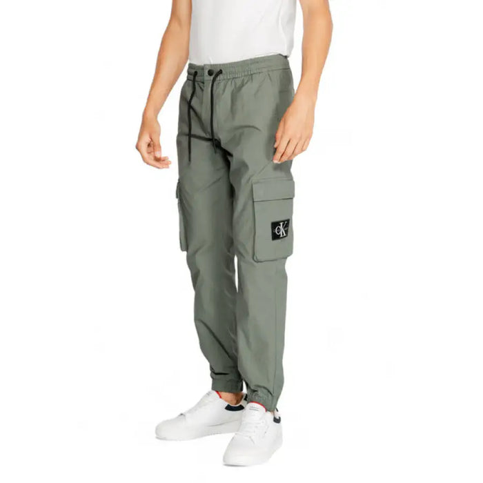 Olive green cargo pants with drawstring waist and side pockets, CK logo patch, Calvin Klein Men Trousers