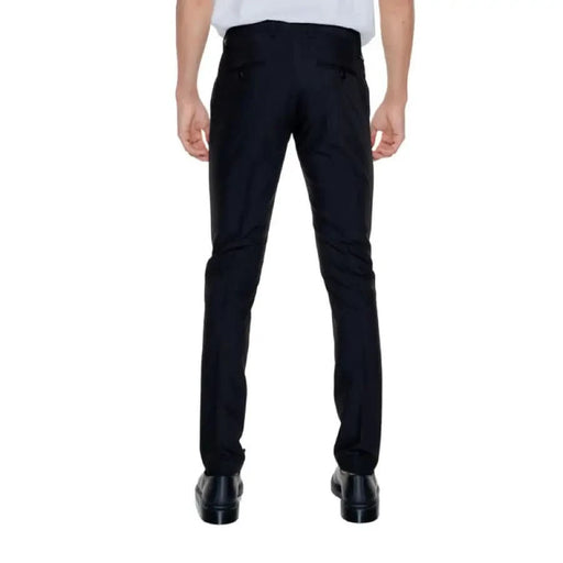 A pair of black slim-fit dress pants worn by a person, Antony Morato Men Trousers