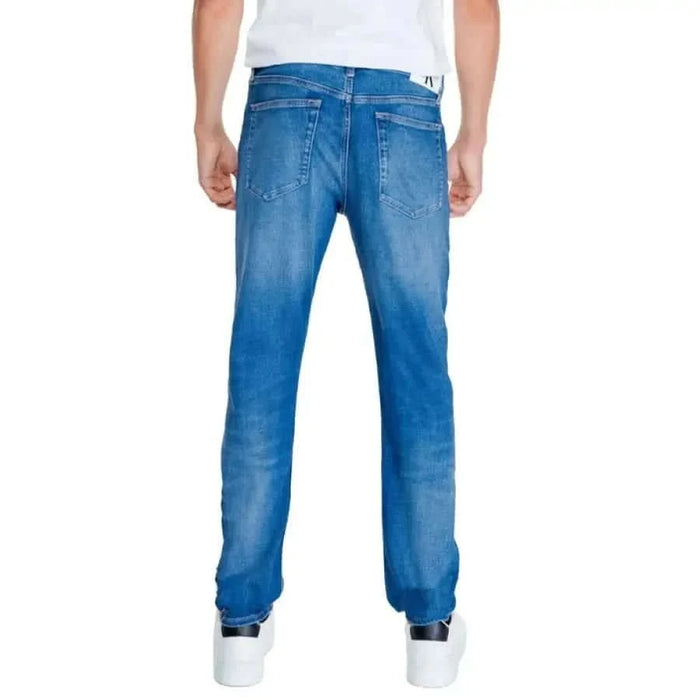 Back view of blue denim Calvin Klein Jeans for men showcasing stylish design