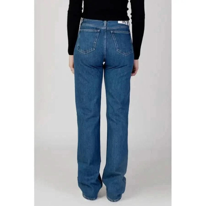 Calvin Klein Jeans Women - Blue Denim Jeans paired with a Black Top