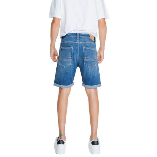 Jack & Jones Men Shorts: Blue denim shorts with rolled-up cuffs worn by a person