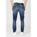 Slim fit blue denim jeans with distressed detailing by Tommy Hilfiger for men