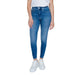 Blue skinny jeans with white sneakers and top, styled as Calvin Klein Women Jeans