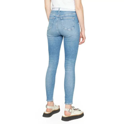 Light blue skinny jeans worn by a person - Calvin Klein Jeans Women Collection