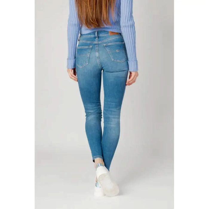 Tommy Hilfiger Women Jeans: Light blue skinny jeans with pale blue sweater and white sneakers