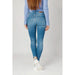 Tommy Hilfiger Women Jeans: Light blue skinny jeans with pale blue sweater and white sneakers