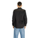 Man in black button-up shirt and blue jeans from behind showcasing Replay Men Shirt