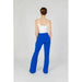 Person in cobalt blue Only Women Trousers showcasing urban city fashion