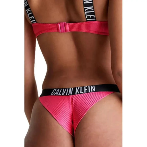 Pink Calvin Klein thong underwear with black elastic waistband for women beachwear