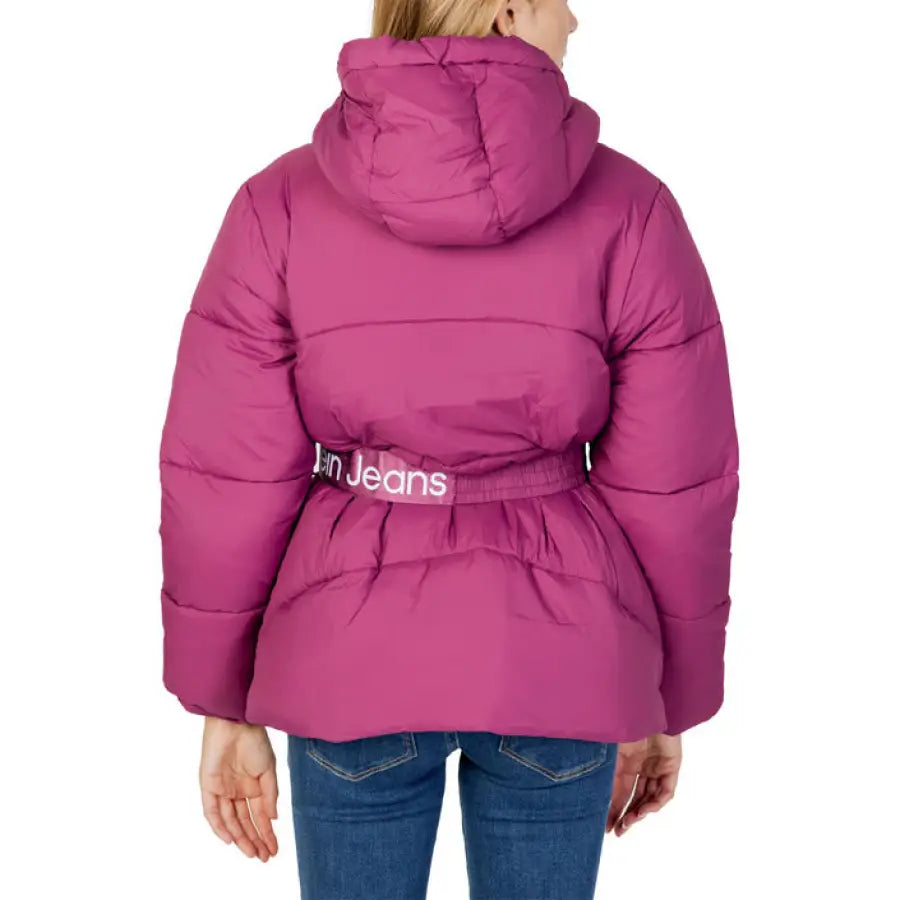 Women’s Pink Puffer Jacket with Hood and Belt, Worn Over Blue Jeans - Calvin Klein Jeans