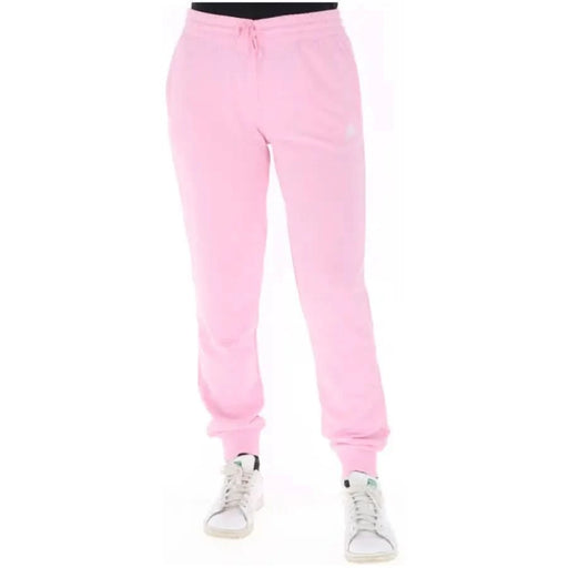 Pink Adidas Women’s sweatpants featuring elastic cuffs and a drawstring waist