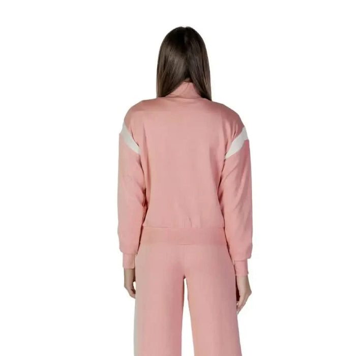 Pink tracksuit with white accent stripes displayed from the back, Guess Active Women’s