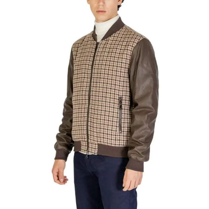 Plaid bomber jacket with brown leather sleeves and white turtleneck by Gianni Lupo