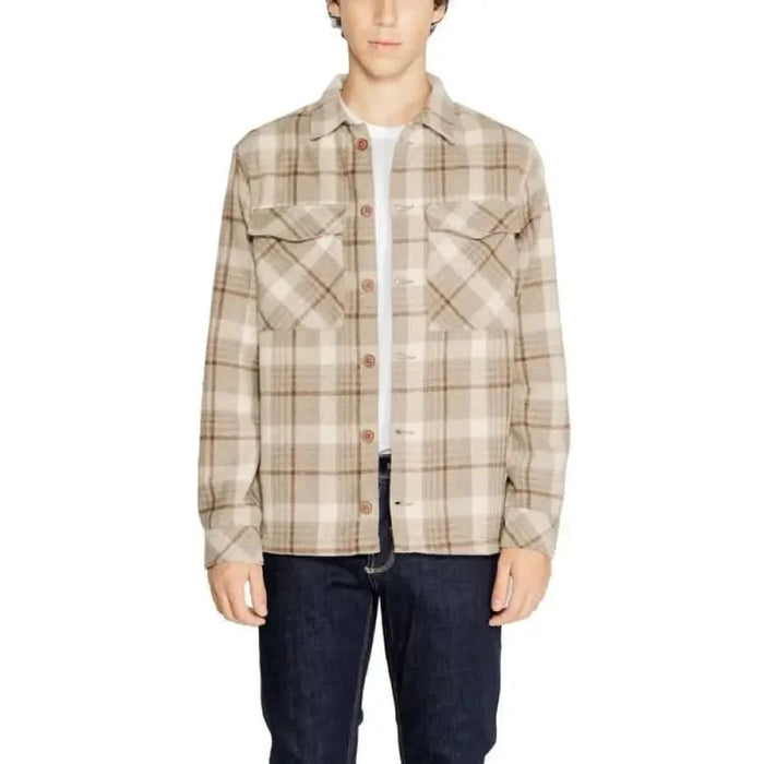 Plaid flannel shirt with chest pockets over white undershirt by Hamaki-ho