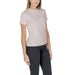 Plain beige crew neck t-shirt paired with dark pants from Calvin Klein Jeans