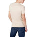 Plain cream-colored t-shirt worn by person in blue jeans from behind Calvin Klein Jeans Men T-Shirt