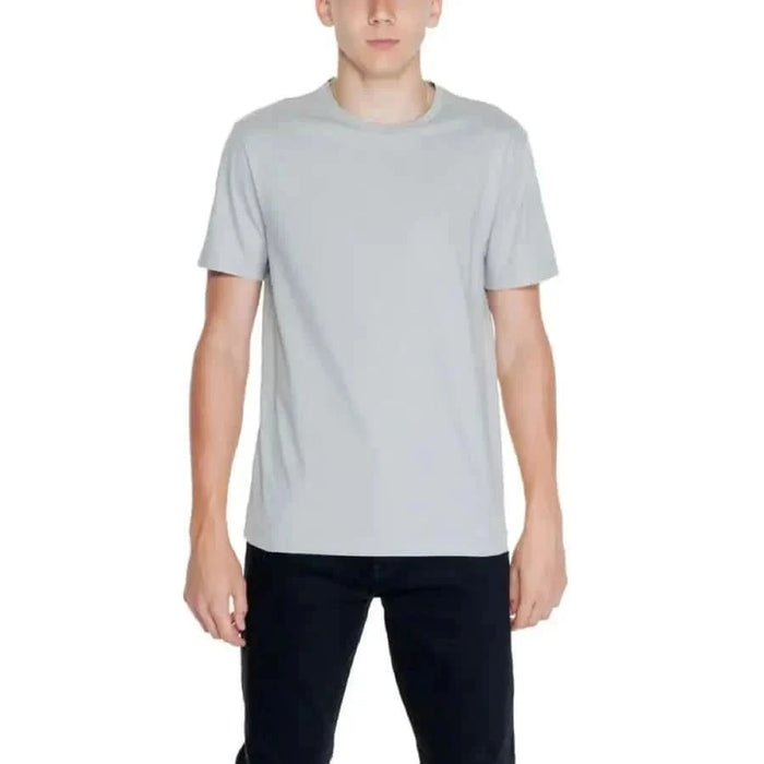 Plain light gray crew neck T-shirt worn by person from Calvin Klein Men T-Shirt collection