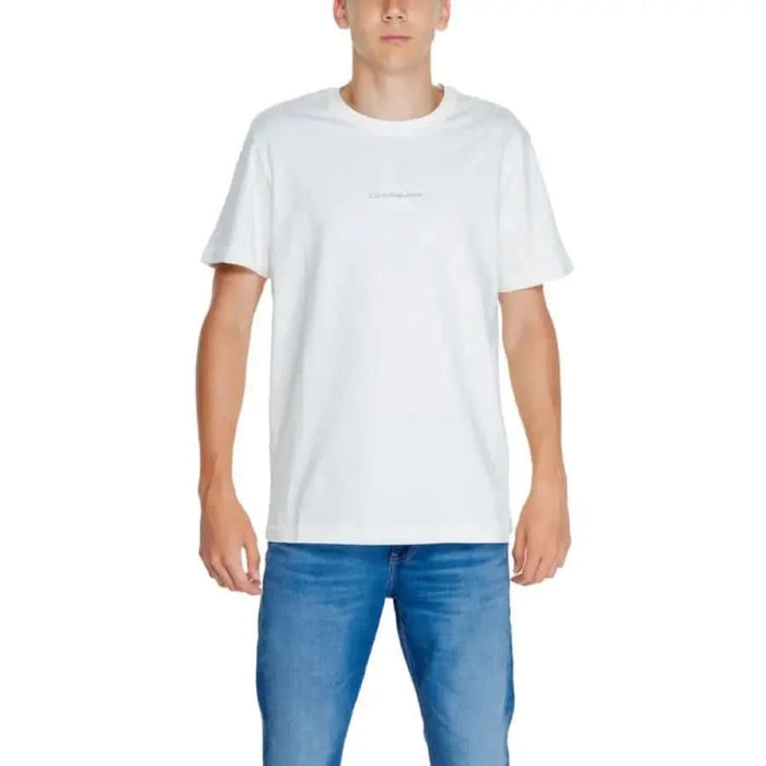 Plain white crew neck t-shirt paired with blue jeans by Calvin Klein Jeans