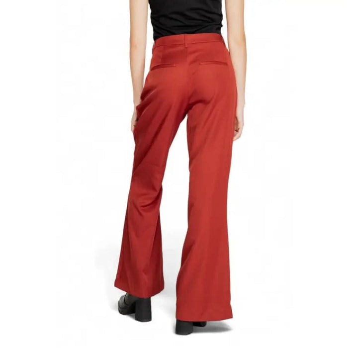 Red flared trousers from behind, part of Vero Moda Women’s Trousers collection