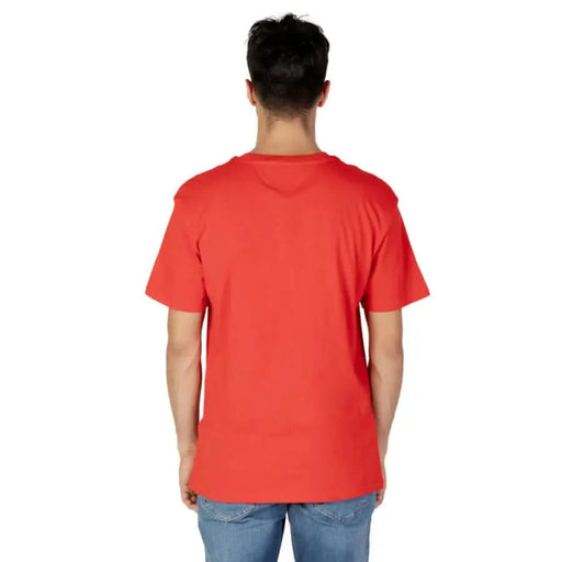 Tommy Hilfiger Jeans Men T-Shirt - Red t-shirt worn by a person viewed from behind