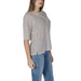 Striped white and gray half-sleeve top with blue jeans styled for B.Young women’s wear